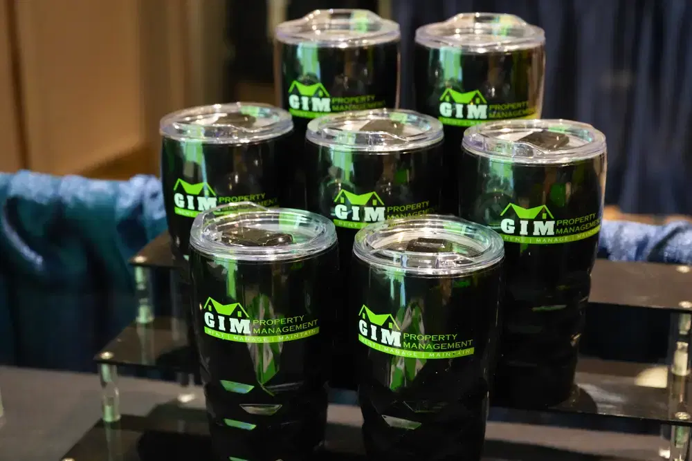 GIM Property Management branded tumblers ready as an event giveaway
