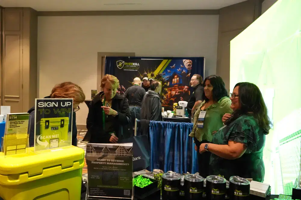 GIM Property Management team networking with industry partners at the company booth
